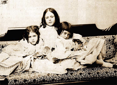 Alice Liddell (right) with sisters circa 1859 (photo by Lewis Carroll)
